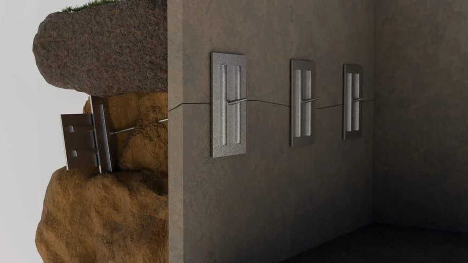 Cutaway render of wall plate anchors tied back through the soil to earth anchors set behind the wall