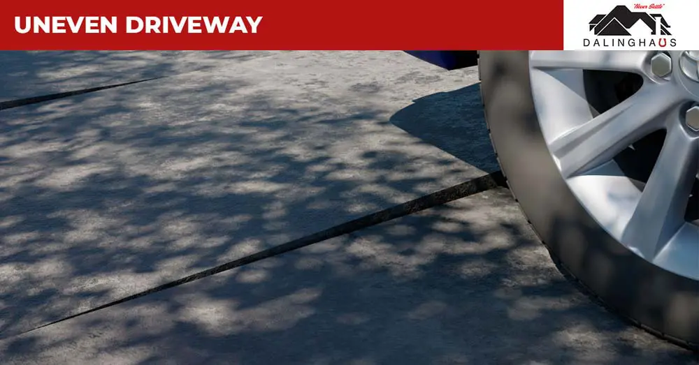 Dalinghaus graphic of an uneven concrete driveway with a raised slab edge beside a car tire