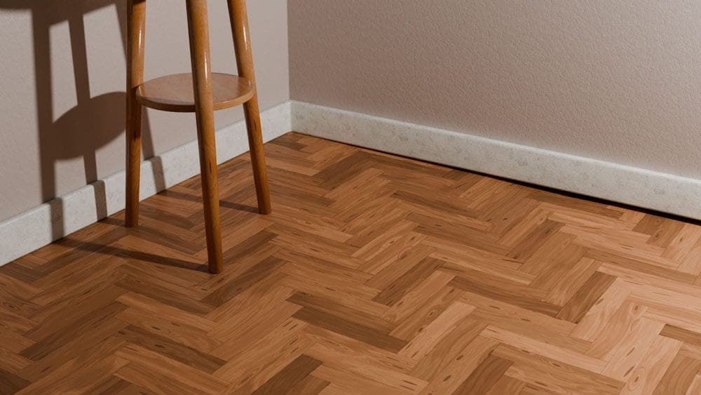 Herringbone parquet floor pulled away from the skirting board, leaving a gap along the wall