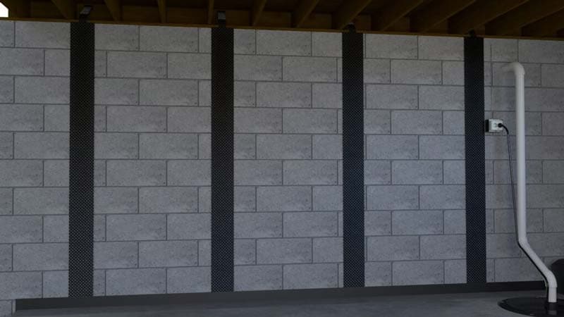 Dalinghaus Foundation Repair carbon fiber straps bonded up a concrete block wall to hold it against further movement