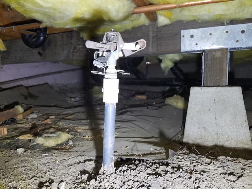 Dalinghaus Foundation Repair crawl space jack post set on a concrete footing to carry a floor beam