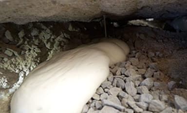 Dalinghaus Foundation Repair filling a concrete void under a concrete slab with structural foam injection.