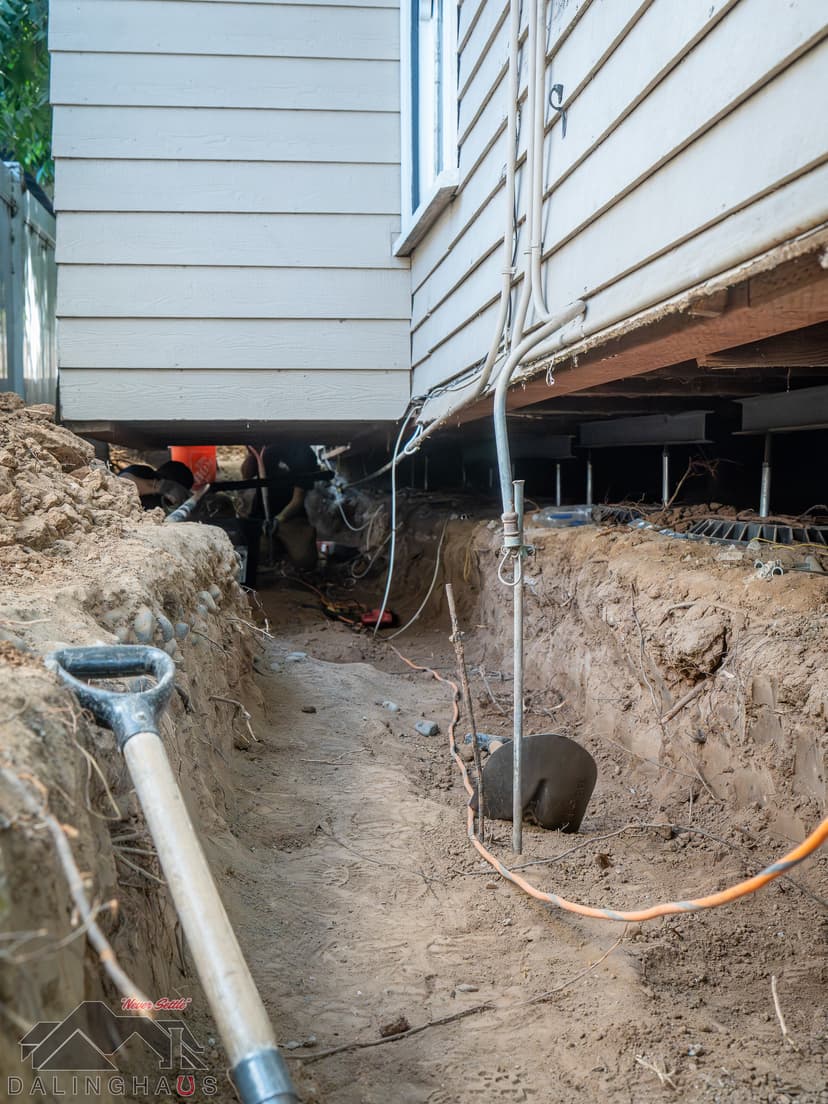 Dalinghaus Foundation Repair installing crawl space jacks and performing foundation underpinning with excavation