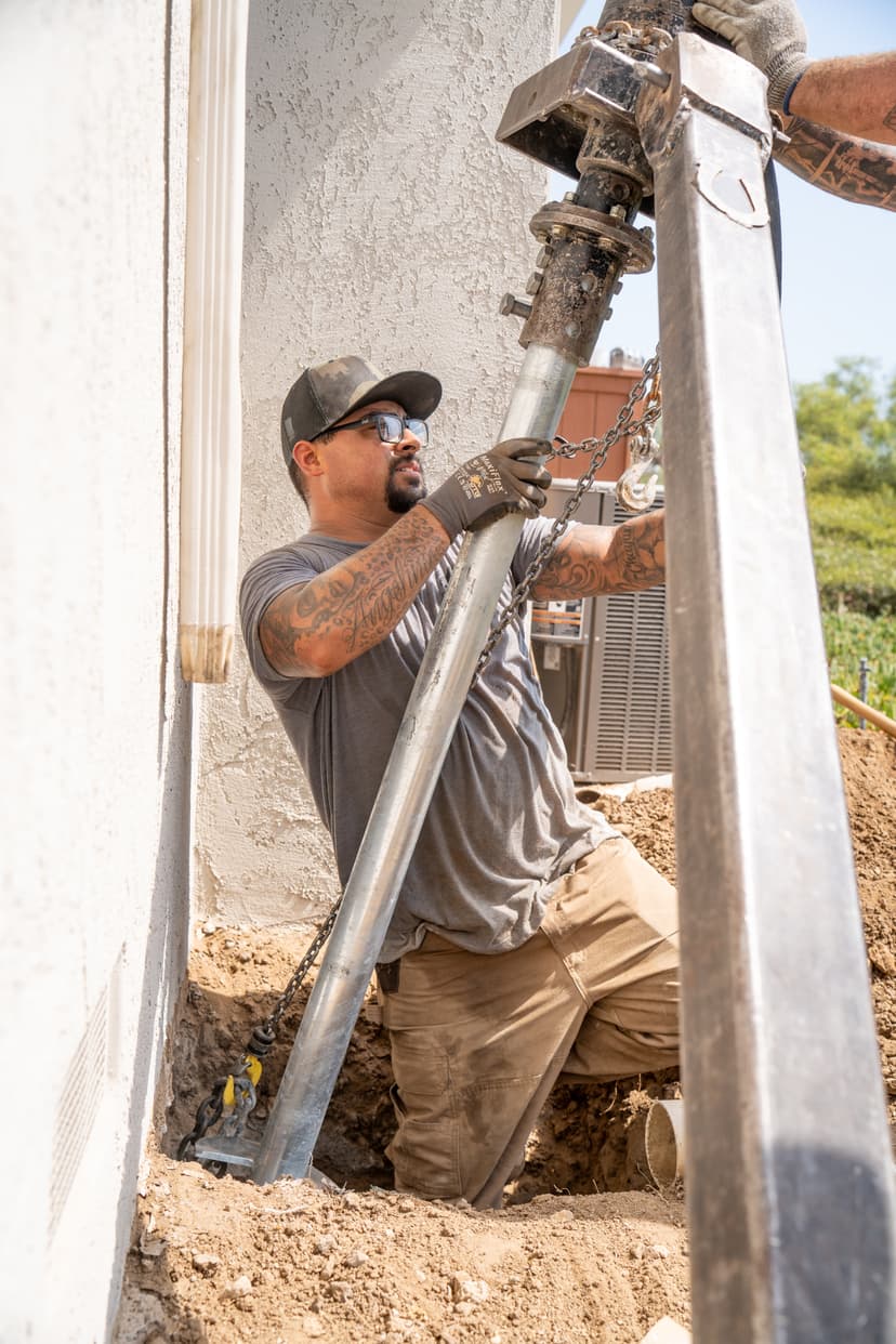 Dalinghaus Foundation Repair installing steel push piers for foundation underpinning and stabilization