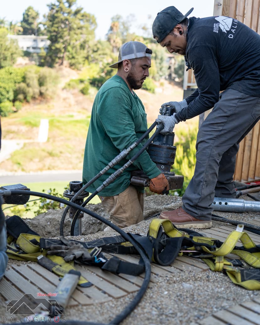 Dalinghaus Foundation Repair crew installing push piers for foundation stabilization.