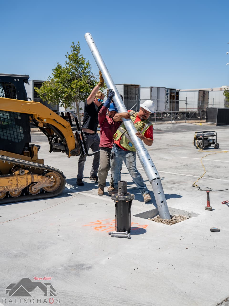 Dalinghaus Foundation Repair crew installing a helical pile for a solar array foundation, ensuring stable ground support.