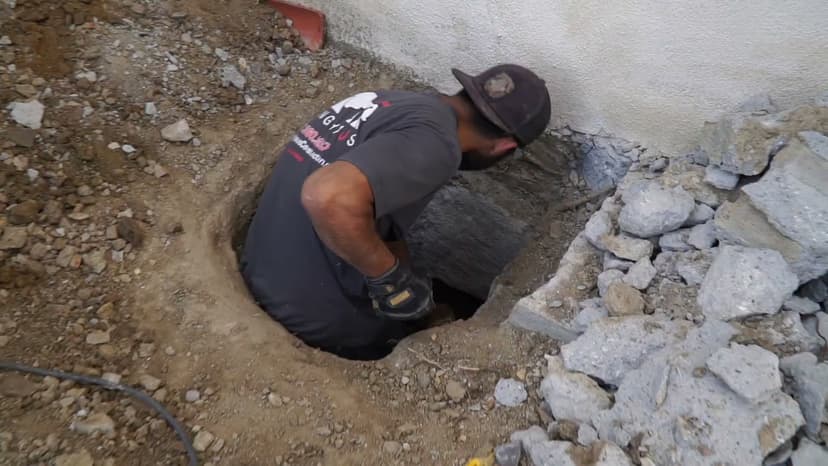 Dalinghaus Foundation Repair crew member performing excavation work for an exterior foundation repair project.