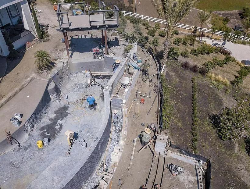 Dalinghaus Foundation Repair crew working on a large hillside retaining wall project