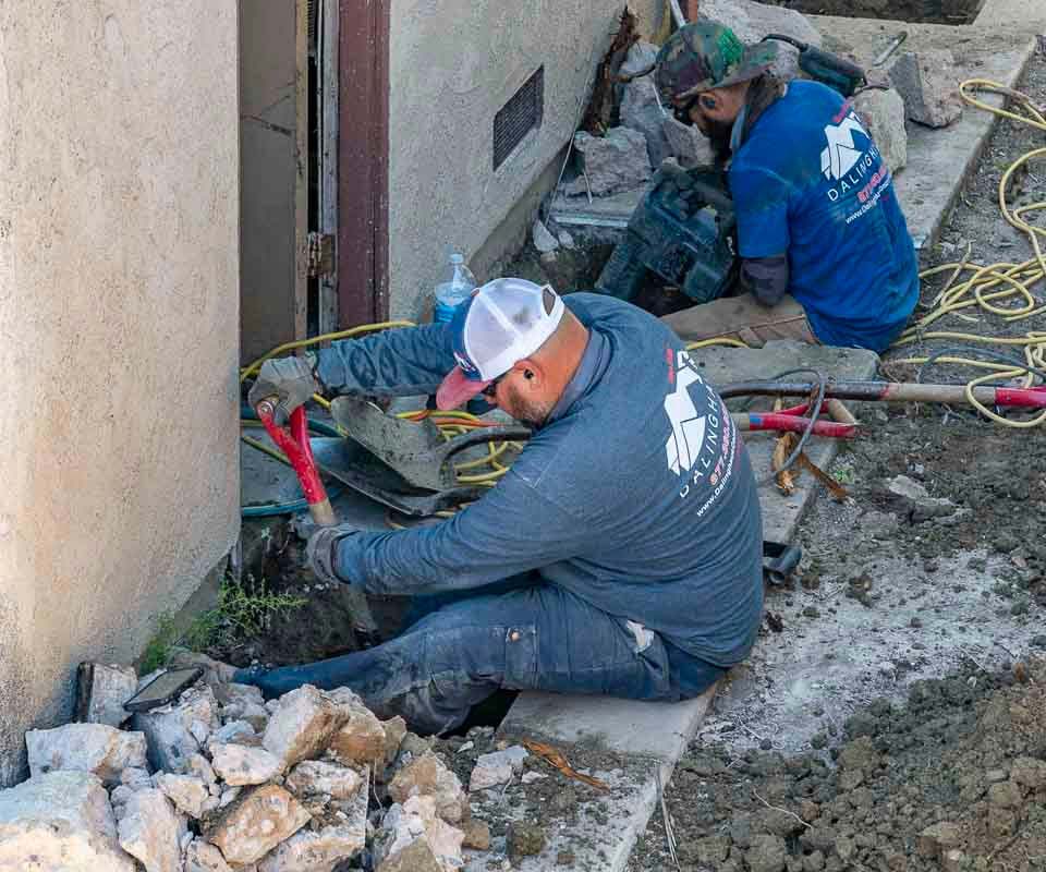 Dalinghaus Foundation Repair crew performing structural excavation and site preparation for foundation underpinning.