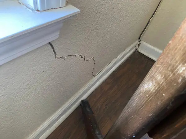 Dalinghaus Foundation Repair identifies diagonal drywall cracks in an interior wall near a window