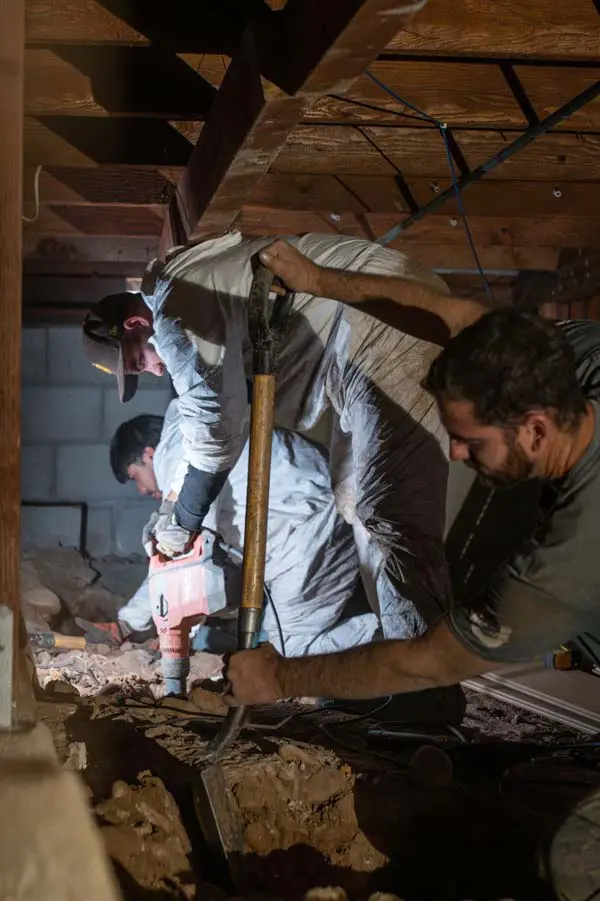 Dalinghaus Foundation Repair crew performing structural excavation for crawl space expansion