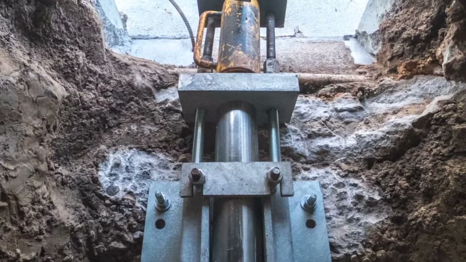 Dalinghaus Foundation Repair installing a hydraulic push pier system for foundation underpinning in Chino Hills.