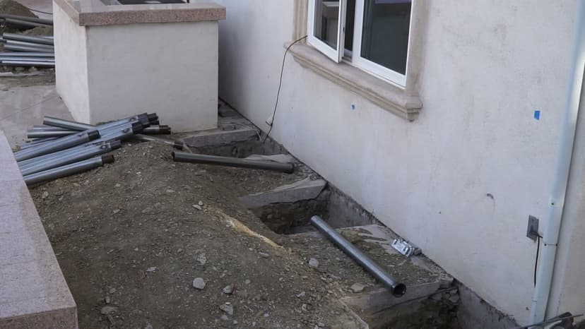 Dalinghaus Foundation Repair crew installing steel push piers for foundation underpinning with excavation in Diamond Bar