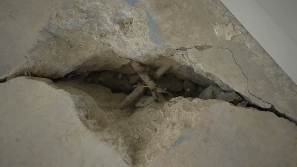 Dalinghaus Foundation Repair inspecting concrete spalling with rebar exposed for crack repair