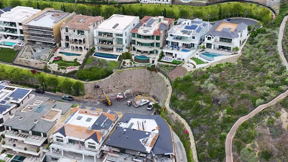 Dalinghaus Foundation Repair performing large-scale slope remediation and retaining wall construction in Why.