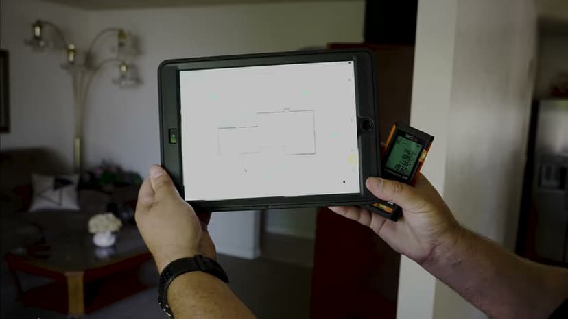 Dalinghaus Foundation Repair technician performing foundation inspection with iPad and laser measurement device.