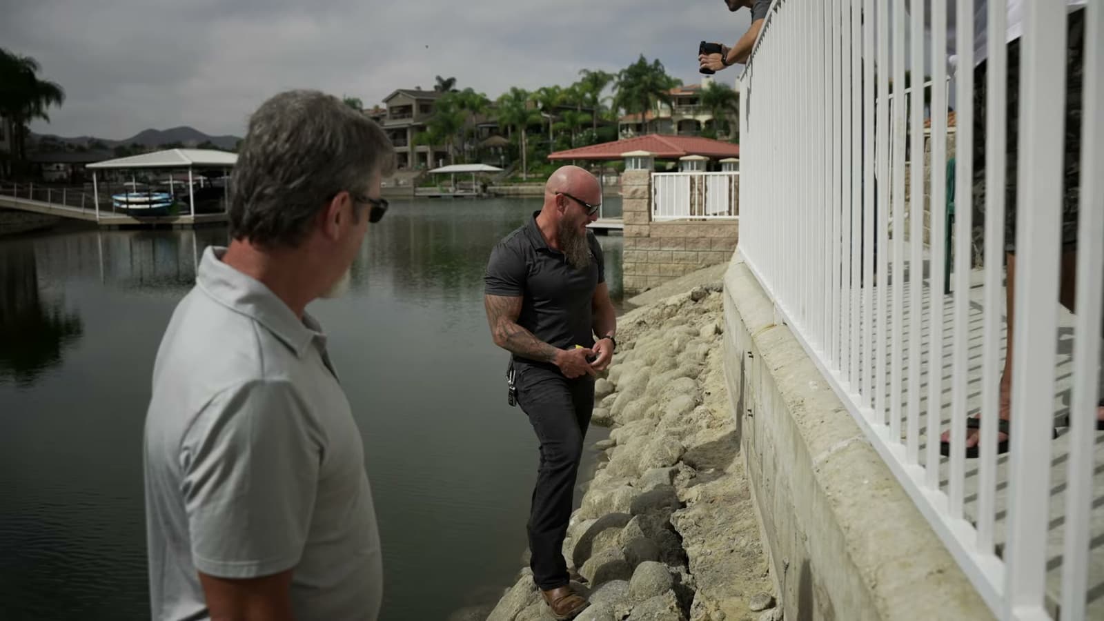 Dalinghaus Foundation Repair expert performing a seawall inspection beside a lake in California.