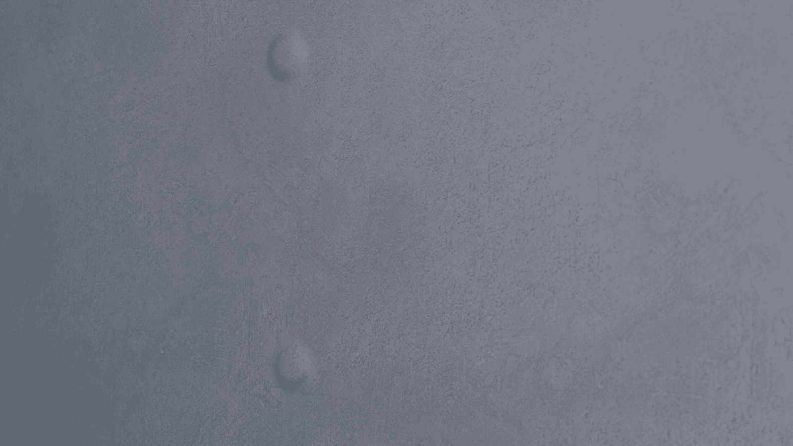 Illustration of a close-up detail of a nail pop defect on a textured gray drywall surface