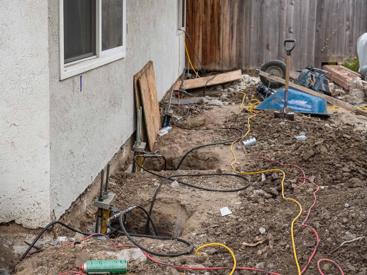 Lifting a settled Irvine home 3 inches with helical piers