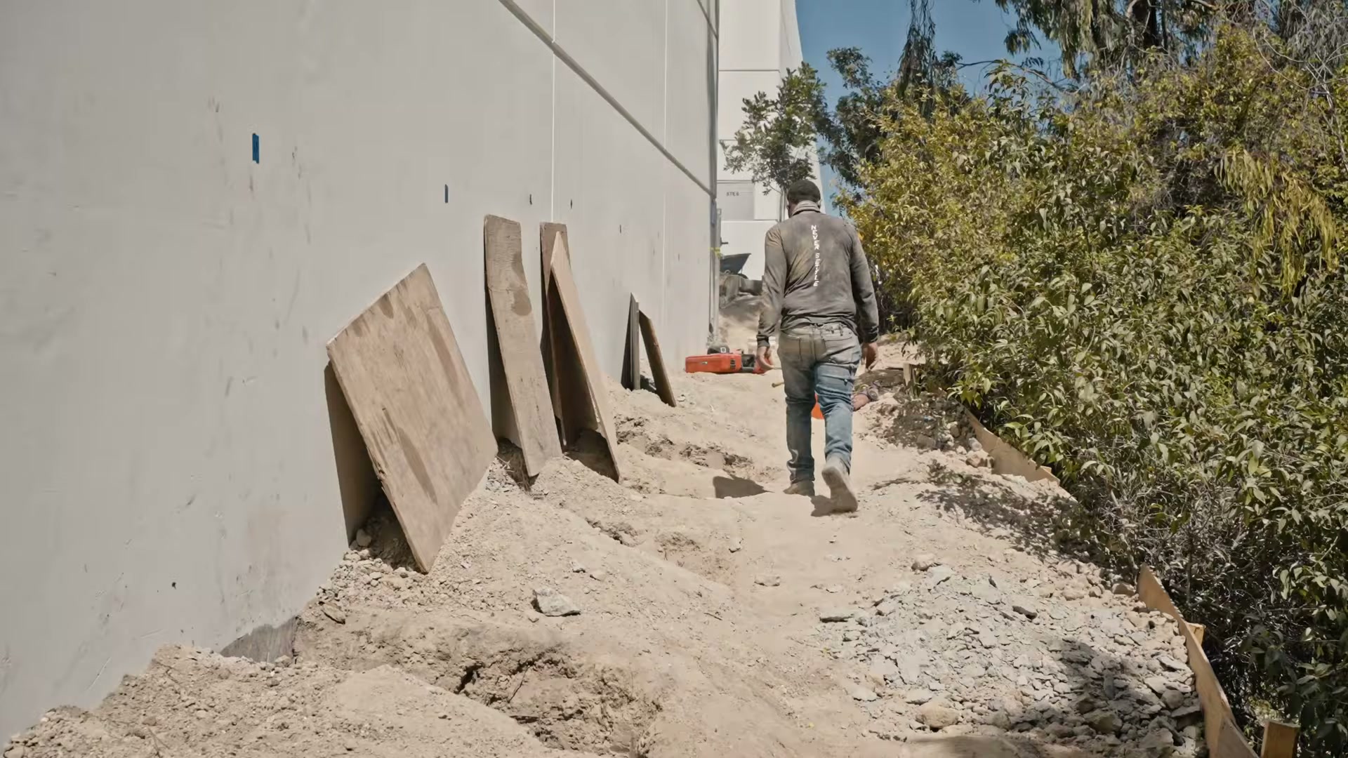 Push piers under a tilt-up warehouse. Video preview.