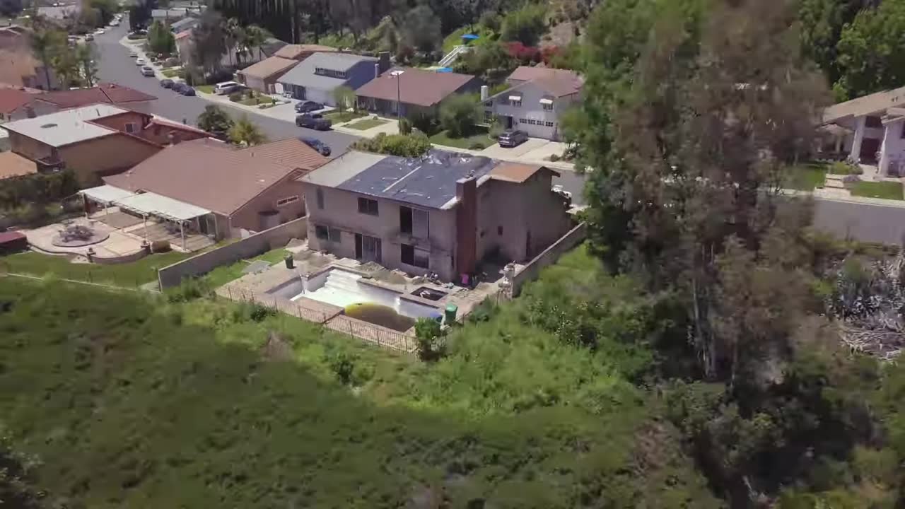 The hillside home from above in the first week. Video preview.