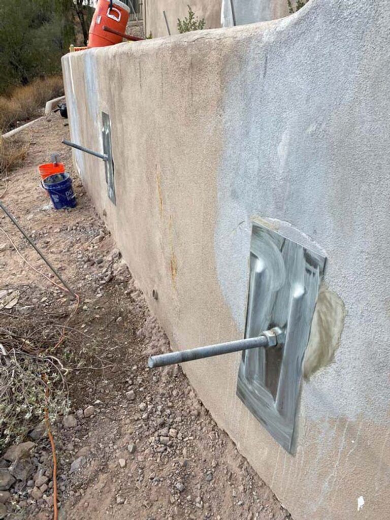 Wall plate anchors stabilize foundation walls that are bowing or leaning inwardly.