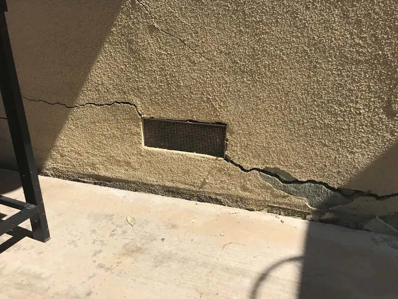 Fixing foundation cracks from the outside is not appropriate in all cases. While underpinning is done from outside, fixing a bowed wall is done from the inside.