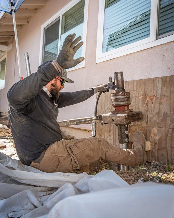 Discover the hidden risks of DIY sinking foundation repair, including structural hazards and long-term expenses. Learn why professional assistance is essential.